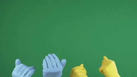Hands with protective rubber gloves rising up and waving to invite on chroma key Stock Footage 155615329