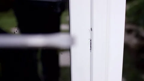 Hands Prying Open White Window with Crowbar, Home Break In, Close Up Shot Stock Footage 341527311