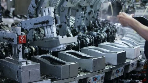 Hands pull out the rubber soles from the machine for molding shoe soles. Stock Footage 82119251