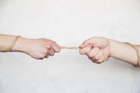 Hands pulling rope. High quality photo 스톡 사진