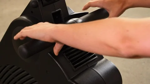 Hands pulling rowing handle of rowing machine Video stock 105126988