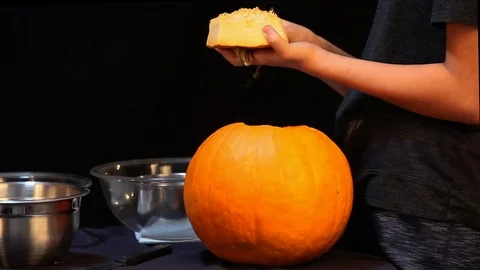 Hands Pulling Seeds Off Pumpkin Lid Stock Footage 97660533