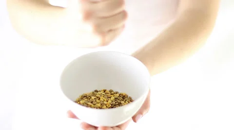 Hands puring fava beans and lentil in a small plate Stock Footage 34865812