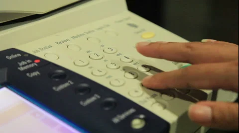 Hands pushing buttons on fax machine Stock Footage