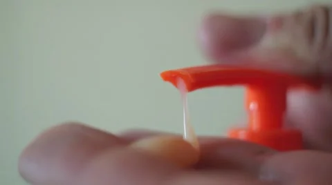 Hands Pushing Container With Liquid Soap Stock Footage 50424729