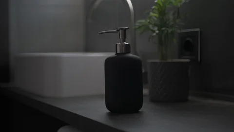 Hands pushing a soap dispenser Stock Footage 127628227