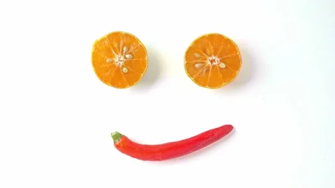 Hands put the chilli pepper on the table and the oranges were cut in half. Put i Video stock 145137327