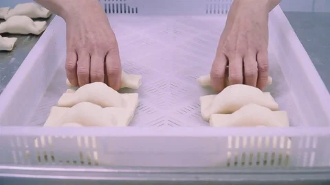 Hands put dumlings into white box Stock Footage 73374635