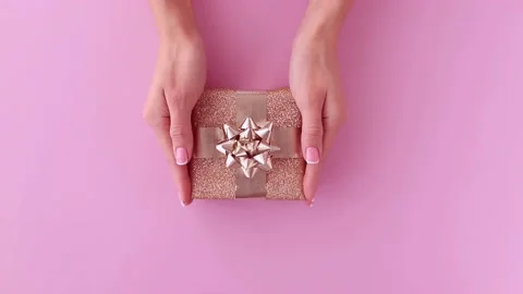 Hands put a gift box on the table are presented with a gift Stock Footage 195994321