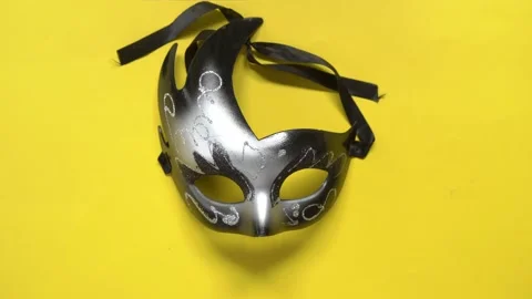 Hands put mask on the table. yellow background Stock Footage 130209026