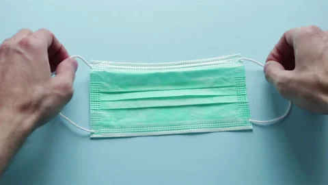 Hands put on protective mask first person view coronavirus prevention Stock Footage 126698205