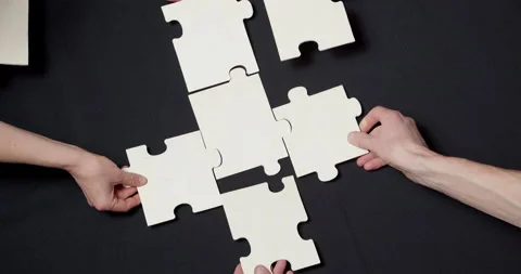 Hands put together jigsaw puzzles. Business team concept. Stock Footage 165496667