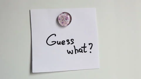 Hands put on white board words: Guess what- Baby. Motherhood concept. 動画素材 65340227