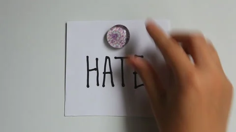 Hands put on the white wall Word Hate, and then Love 動画素材 65313392