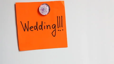 Hands put word Weddind on the white wall Stock Footage 65340475