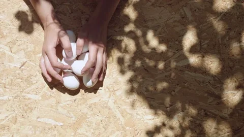 Hands putting bunch of chicken eggs on particle board Stock Footage 275892351