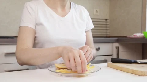Hands putting cheese on bread on kitchen table, food preparation with kitch.. Stock Footage 310828769