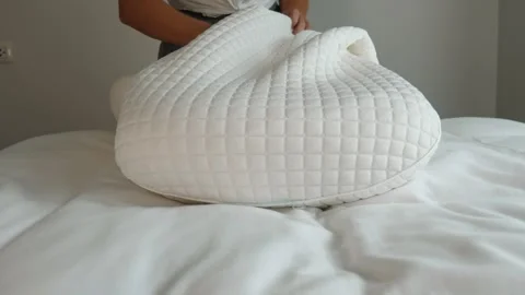 Hands putting pillow into pillowcase, bedroom bed, domestic chores Stock Footage 336858614
