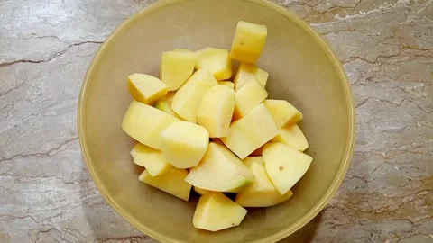 Hands Putting Potato Chunks into Plastic Bowl, Kitchen Stock Footage, Meal  Stock Footage 329094850