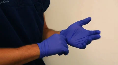 Hands putting rubber gloves Stock Footage 40393311