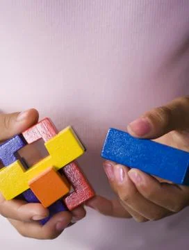 Hands with puzzle Stock Photos
