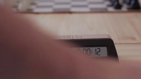 Hands quickly press the timer during a game of chess until the time runs out Stock Footage 205309641