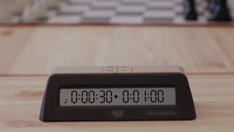 Hands quickly press the timer during a game of chess Stock Footage 205313343