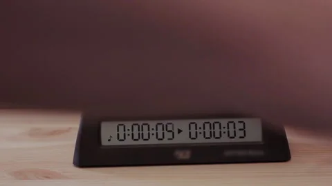 The hands quickly press the timer in the last seconds of the chess game Stock Footage 205308444