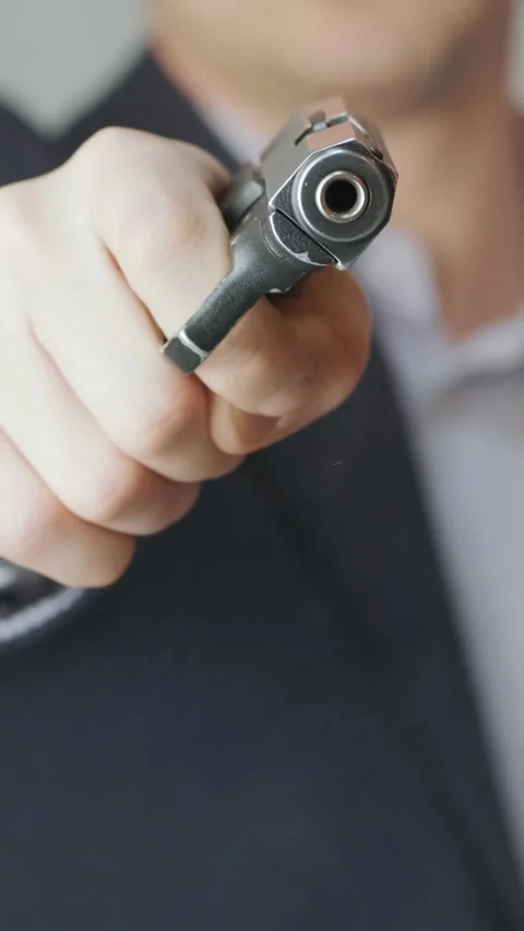 Hands racking the slide of a semi-automatic pistol. Loading and safety concept. Stock Footage 331424595