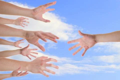 Hands reaching for a helping hand Stock Photos