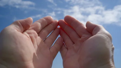 Hands reaching out to the sun against sky background outdoors Stock Footage 270089885