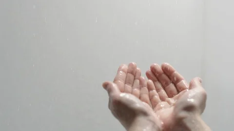 Hands reaching out for water raining down Stock Footage 88050790