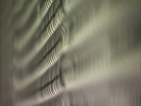 Hands reaching through prison fence Stock Footage 11401903