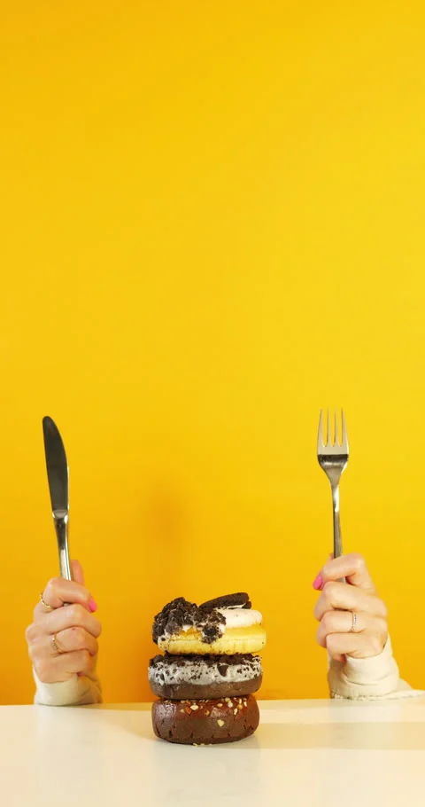 Hands Ready to Eat Donut Stack 動画素材 310937420