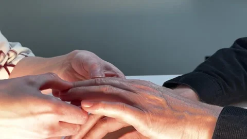 Hands receive gentle massage in close up. Fingers press and relax during a .. Stock Footage 338397759