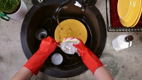 Hands in red rubber gloves washing a glass Stock Footage 80449296