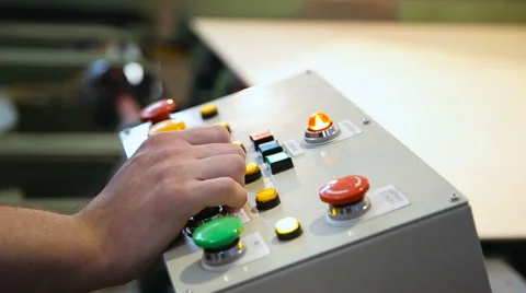 Hands on the remote control of equipment producing plywood Stock Footage 64769791