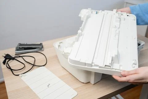 Hands Removing Printer Scanner Part for Home Office Maintenance and Repair .. Stock Photos