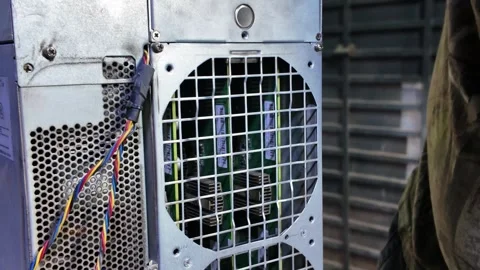 Hands Repairing a Bitcoin Mining Server. Hardware Maintenance Stock Footage 323797240
