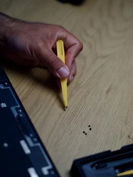 Hands Repairing an Opened Laptop Computer With Precision Tools Stock Photos