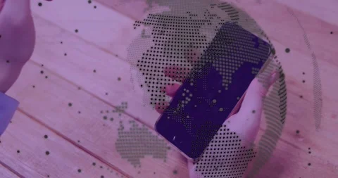 Hands responding to alert tapping swiping rotating smartphone, showing globe Stock Footage 334178851