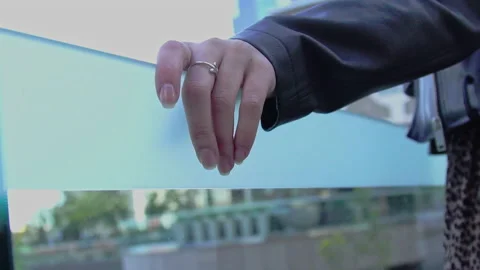 Hands rest on glass railing close 4K Stock Footage 150558899