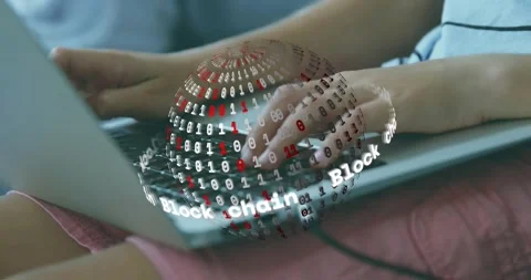 Hands resting on laptop keyboard starting blockchain orb appearing as typing Stock Footage 317123808