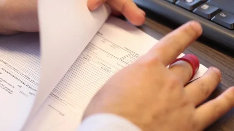 Hands reviewing documents Stock Footage 77046620