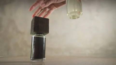 Hands with rings and manicures put brutal perfume bottles in the frame. Bottles Stock Footage 170122396