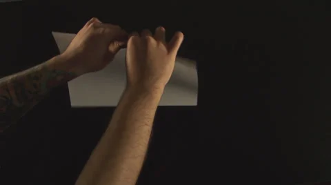 Hands Ripping a White Paper Stock-Footage 34975665