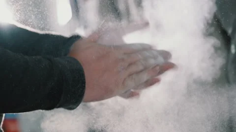 Hands of rock climber at start of the track, he claps his hands, talk powder Video stock 140799688