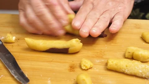 Hands roll and cut the dough for cookies Stock Footage 320068037