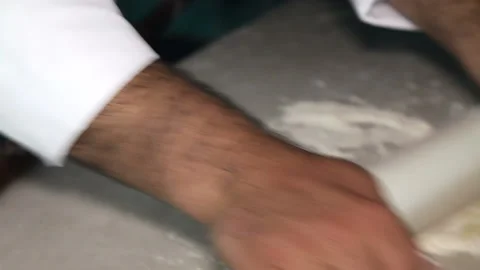 Hands roll the dough with a rolling pin. Close-up Stock Footage 91006977