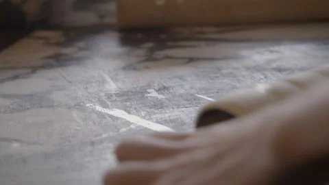 Hands Rolling Dough on a Cylindrical Mold in a Sydney Bakery Kitchen Stock Footage 345658097
